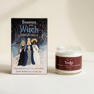 Seasons of the Witch Winter Tarot box beside a Yule mini candle